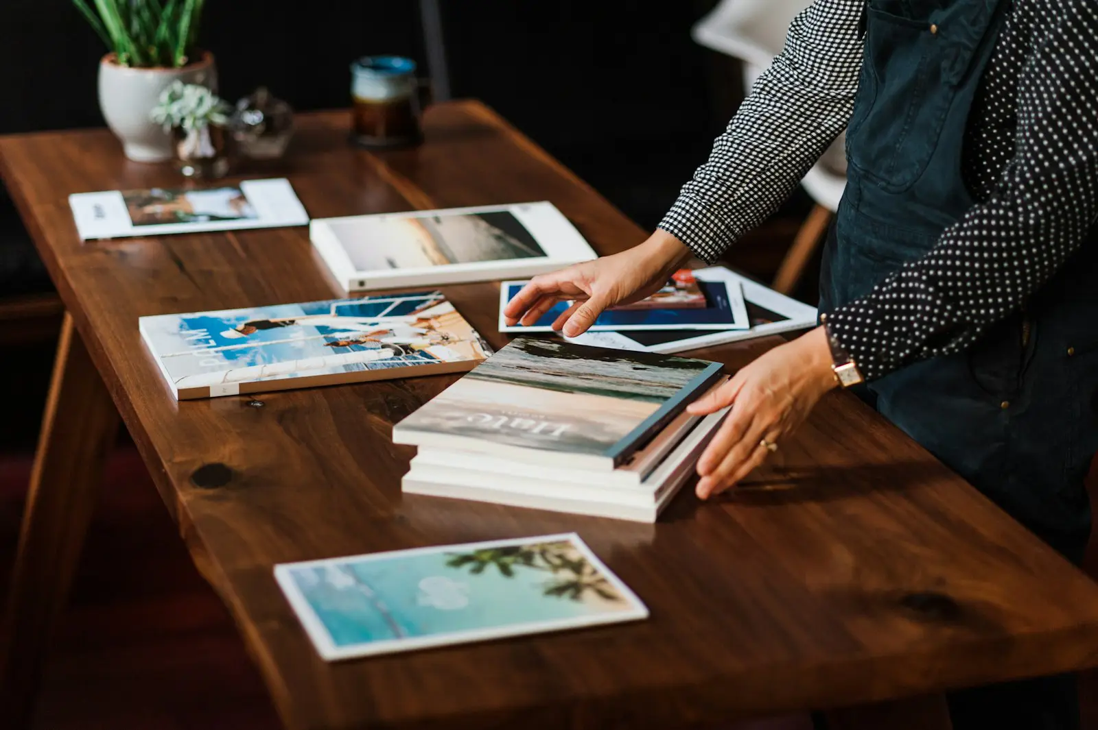 Printed samples and photo books laid out on a table for review