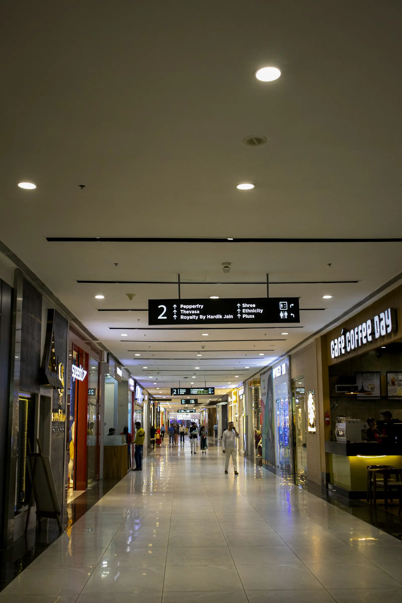 Hanging wayfinding signage in an Indian shopping mall